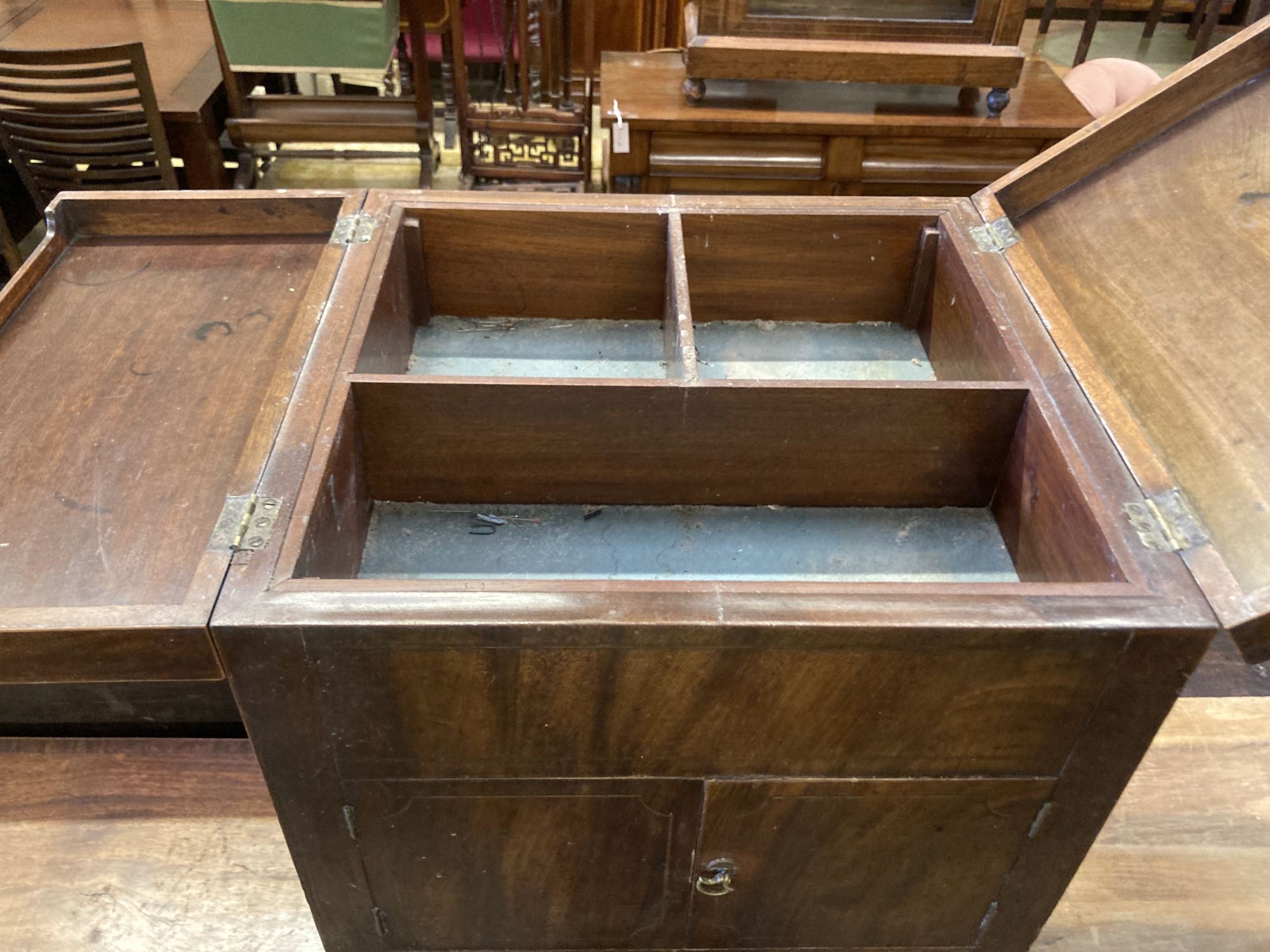 A George III cross banded mahogany enclosed wash stand, width 48cm, depth 46cm, height 79cm